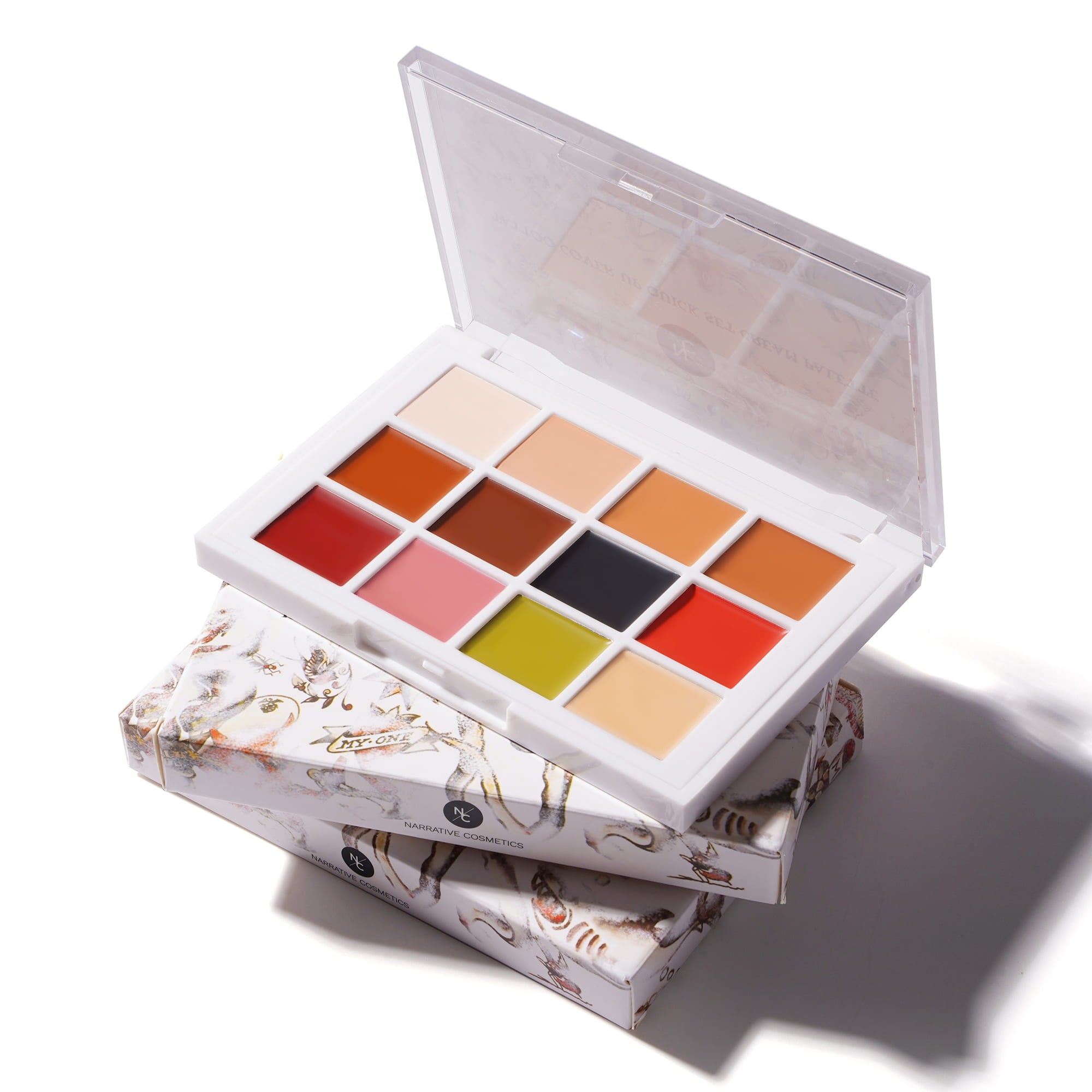 Quick-Set Tattoo Cover-Up Cream Palette open with branded retail cards on white