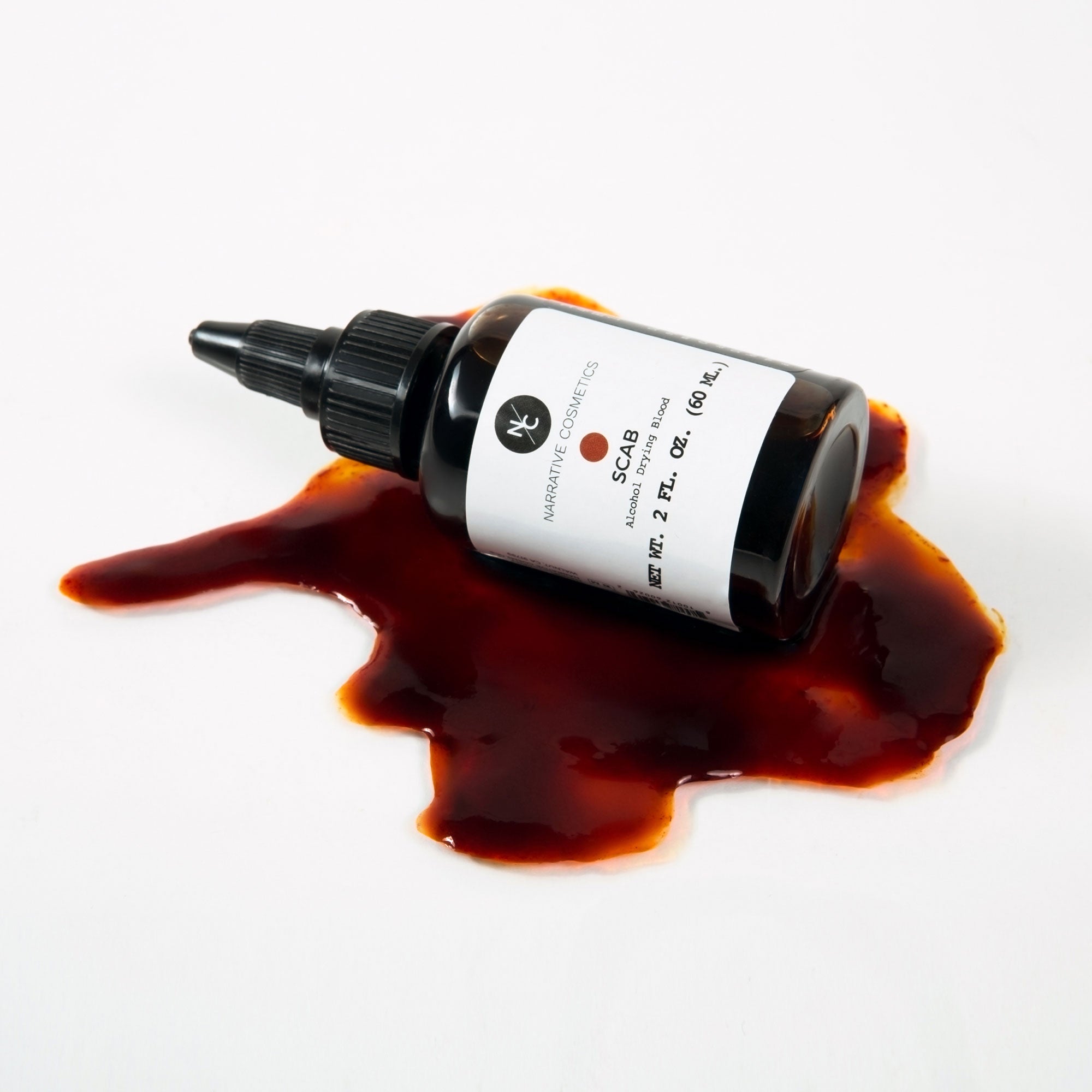 Scab Alcohol Drying Blood bottle spilled on white background