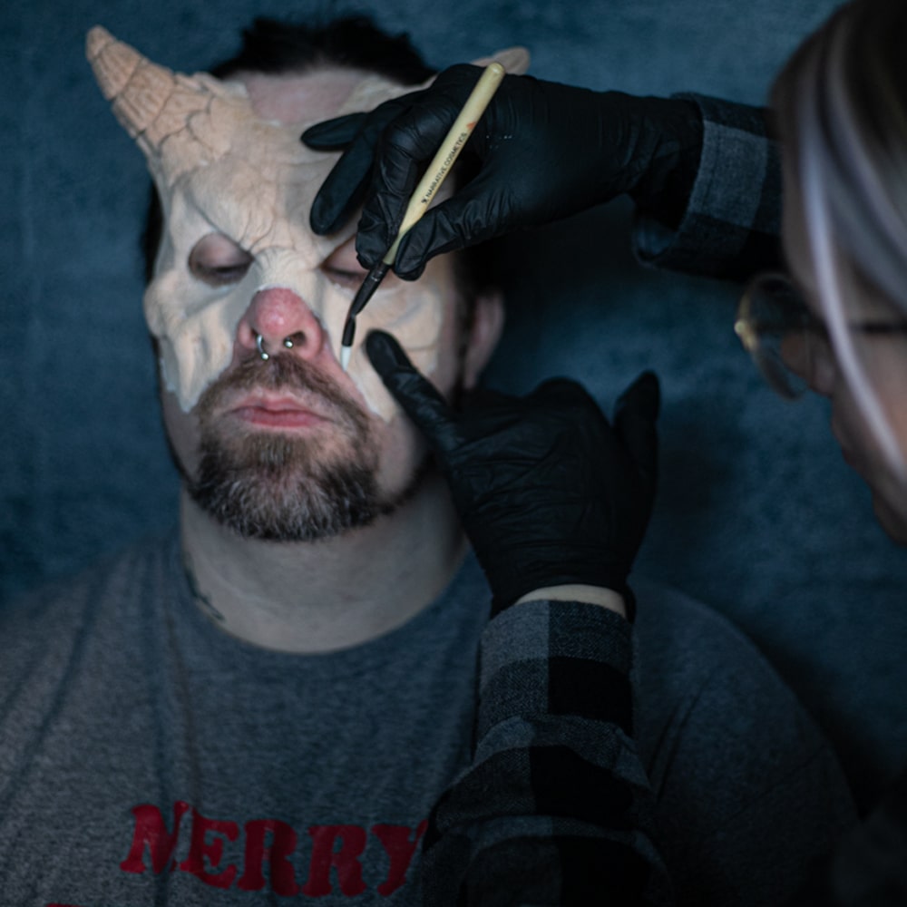 Makeup artist applying Collection 
